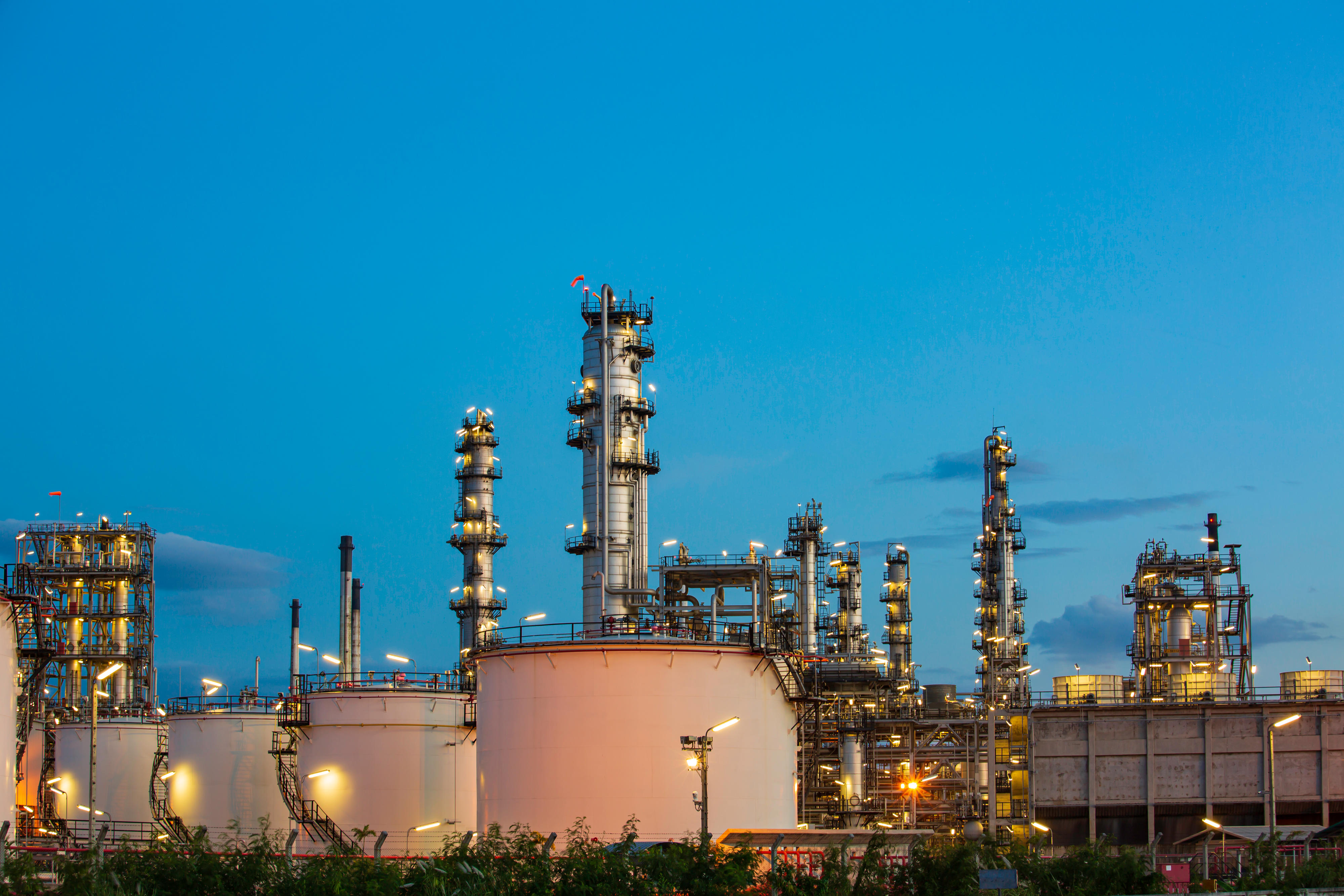 oil-refinery-plant-tower-column-petrochemistry-industry-tank-oil-gas-industrial-with-cloud-blue-sky